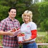 Matt Gallaher, executive chef at the Tennessee Residence, receives some local strawberries from Laura Sleigh of H & S Farms in Clarksville. Gov. Bill Haslam and First Lady Crissy Haslam have committed to using Tennessee grown and made products at the Tennessee Residence whenever possible.