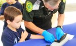 The Harvest Festival included fingerprinting for the kids.