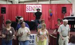 Country entertainer Duece Hulett gets the crowd line dancing.