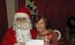 Santa stopped by to congratulate one of our prize winners!