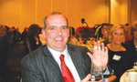 Duncan Williams with award, Outstanding Corporation