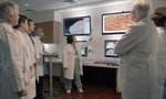 Dr. Carla Davis, a pathologist at Saint Thomas Hospital, discusses a patient's brain tumor with other members of the hospital's Brain Tumor Group. The team meets weekly to develop a proactive, personalized treatment plan for each patient, allowing for more efficient care coordination and better patient consultation.