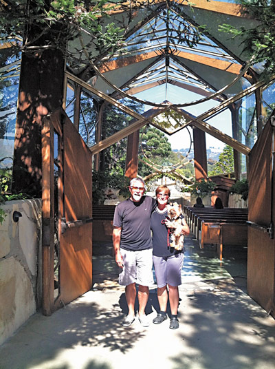 The Gallaghers and their dog, Gatsby, at the Glass Chapel, Palos Verde, California.