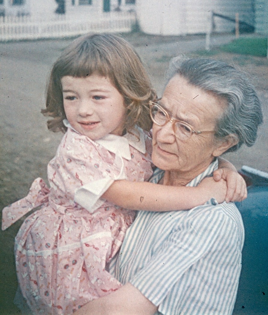 At three, I'm already a bit big for my tiny grandmother to carry, but she was as devoted to me as I remain to her. 