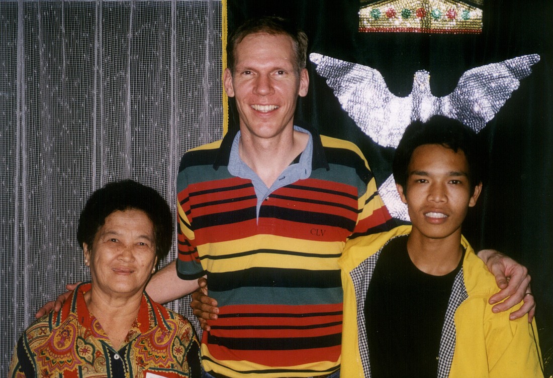 Gerrit with an older and younger companion in Indonesia.