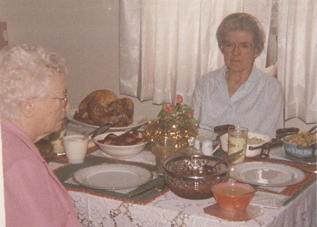 Members of Pat's "church family" at Prosser Methodist Church, at a Christmas dinner--Helen Miller facing and unknown lady across from her.