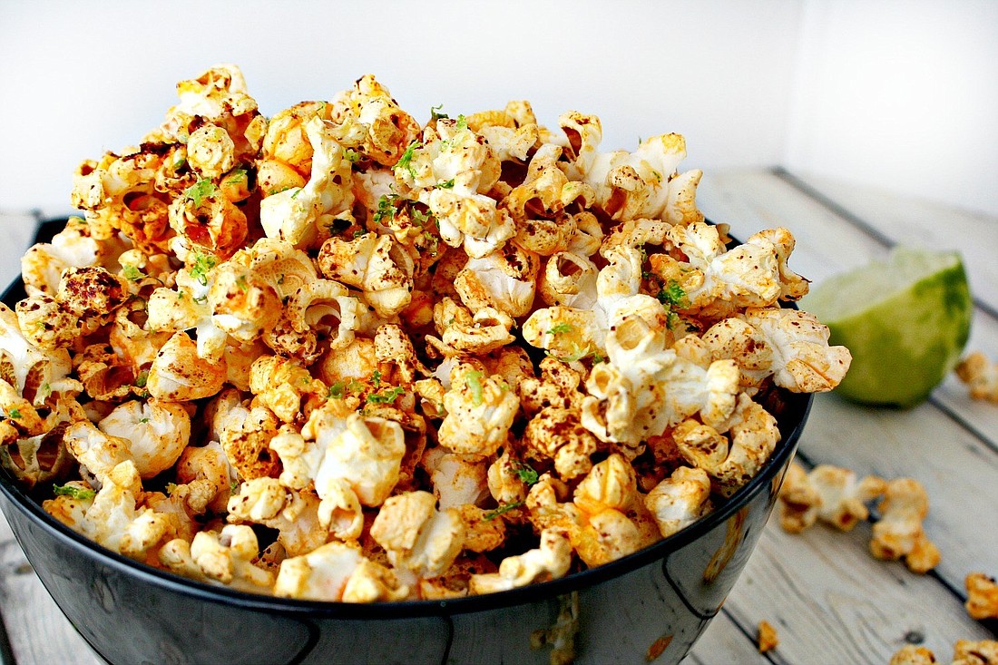 Making savory popcorn at home helps cut the salt in fun snacks served to football game guests.
