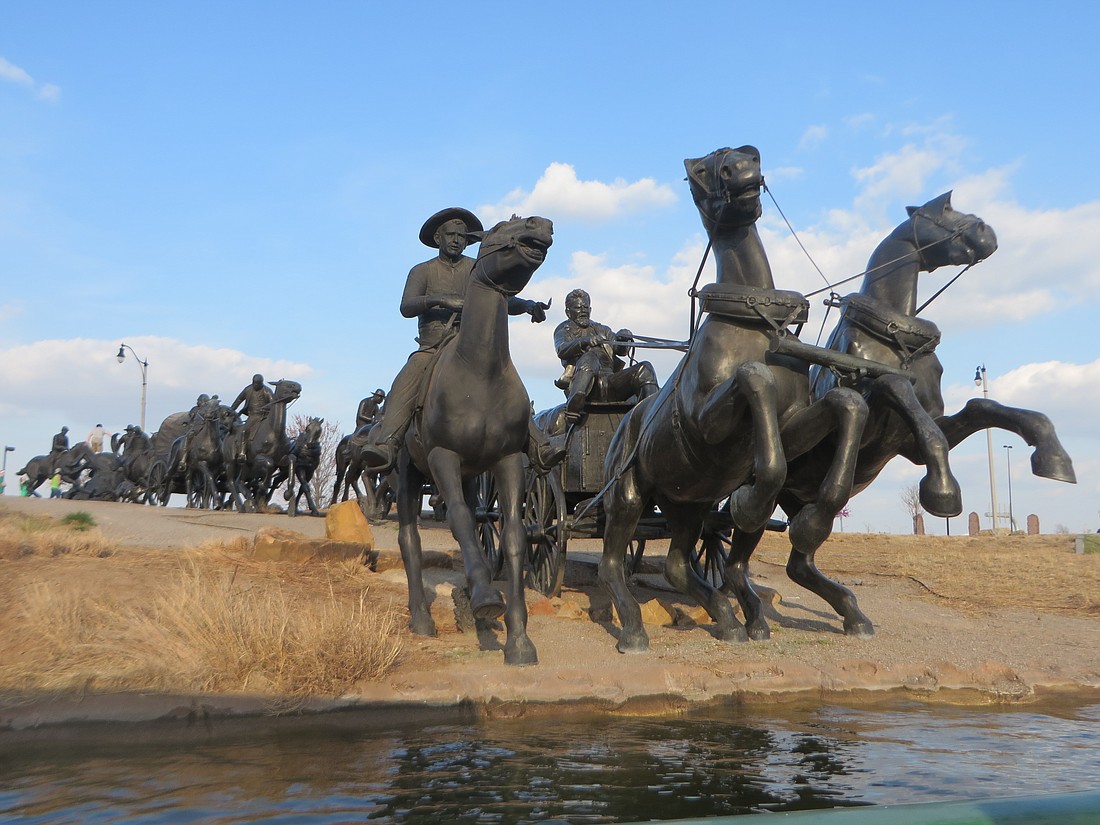 At OKC's Centennial Crossing, large scale sculptures depict the Oklahoma Land Run.
Photo by Debbie Stone