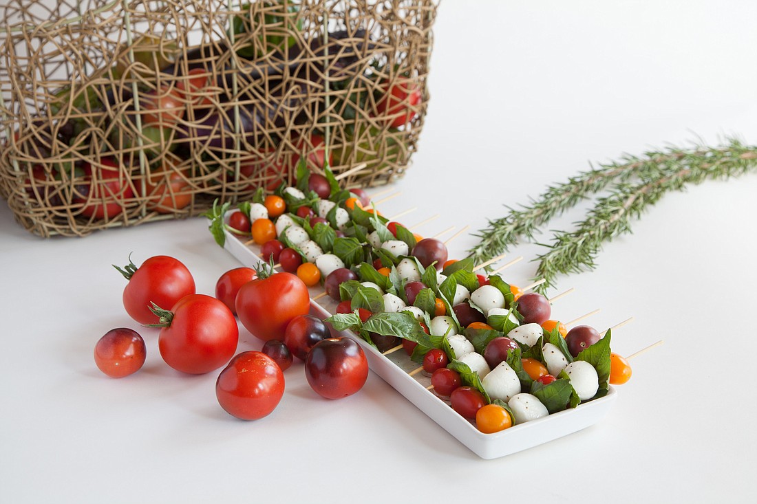 Caprese skewers are an easy, healthy appetizer to bring to a holiday party.