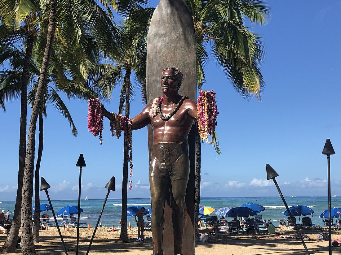 The statue of famed surfer Duke Kahanamoku has a prominent place along Waikiki Beach.
Photo by Debbie Stone