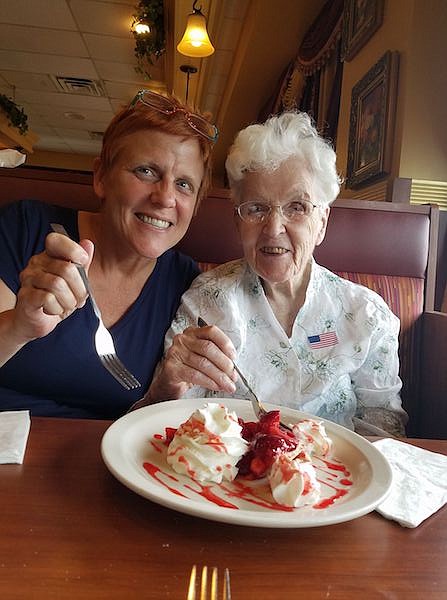 Wendy Pender, Library Corner columnist, enjoying pie with her mother, pictured at age 101.