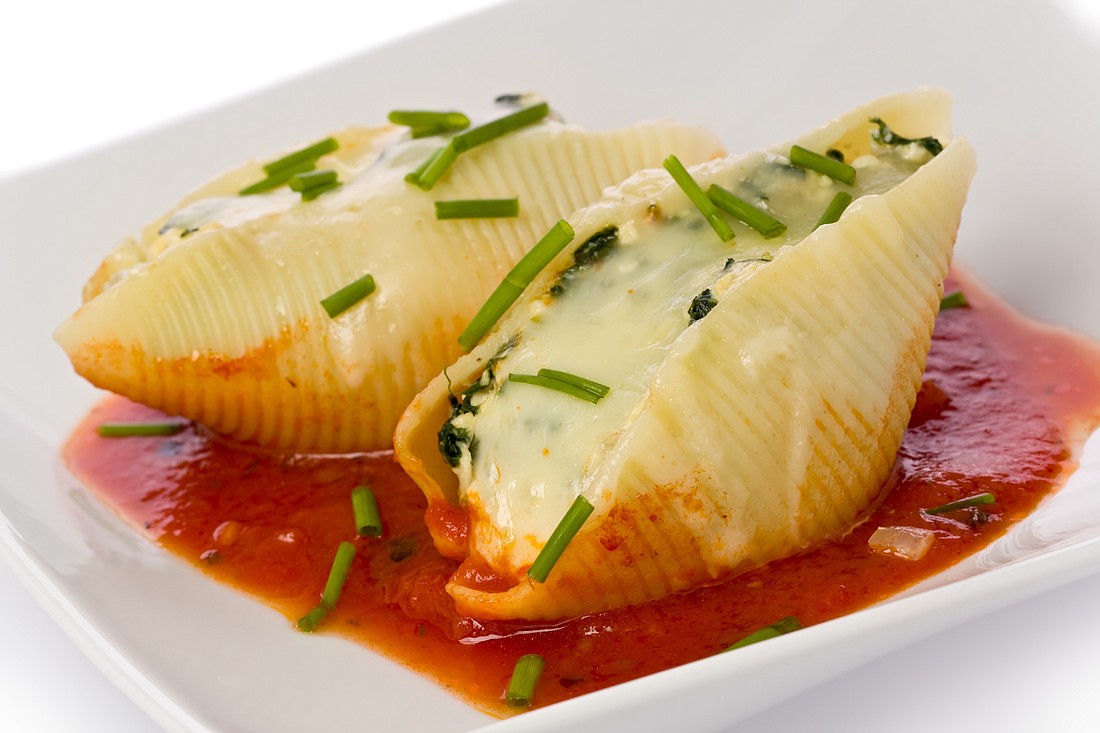 Hiding spinach in stuffed shells is a great way to add a nutritional punch to this traditional Italian dish.