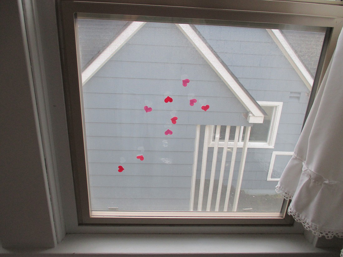 A 3-year-old sweet “interrupter” put these hearts on Ariele’s windowpane.