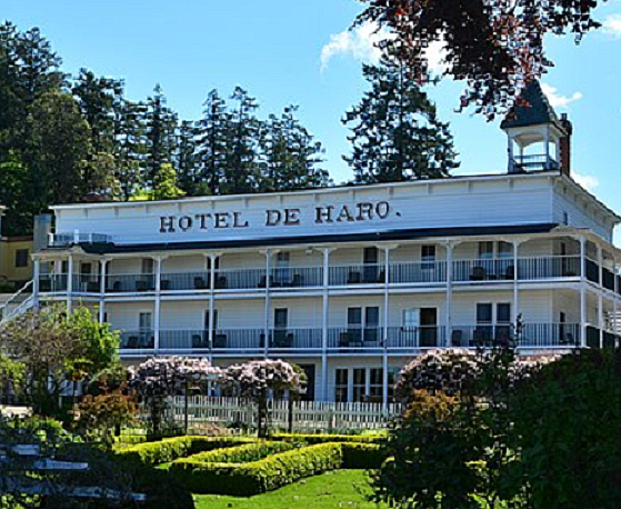 The historic Hotel de Haro sits amongst a formal garden overlooking the village and scenic Roche Harbor