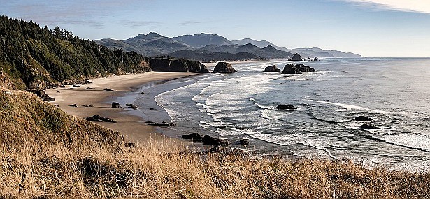 The Oregon Coast is only one of many spectacular regions to visit in the state. This view shows Cannon Beach from Ecola State Park