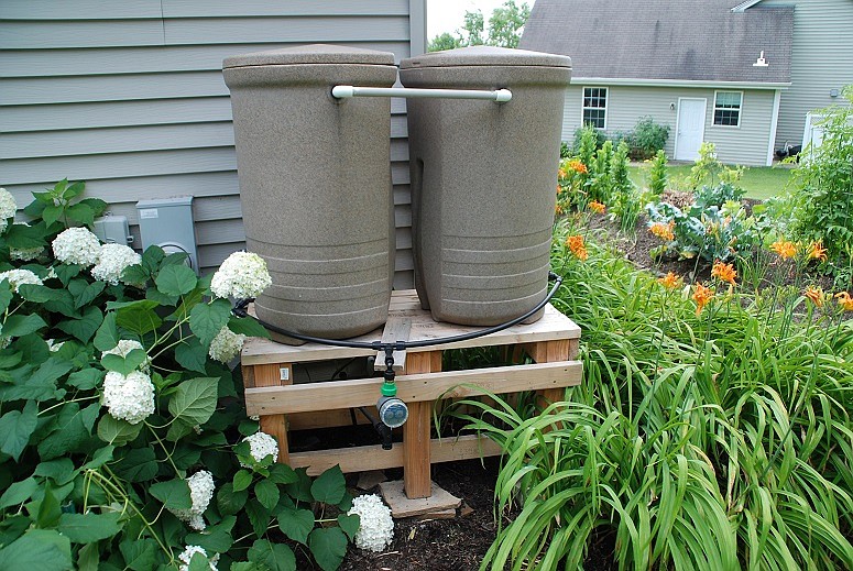 Elevate your rain barrel for easier access to the spigot for filling containers and to speed water flow with the help of gravity, photo courtesy MelindaMyers.com