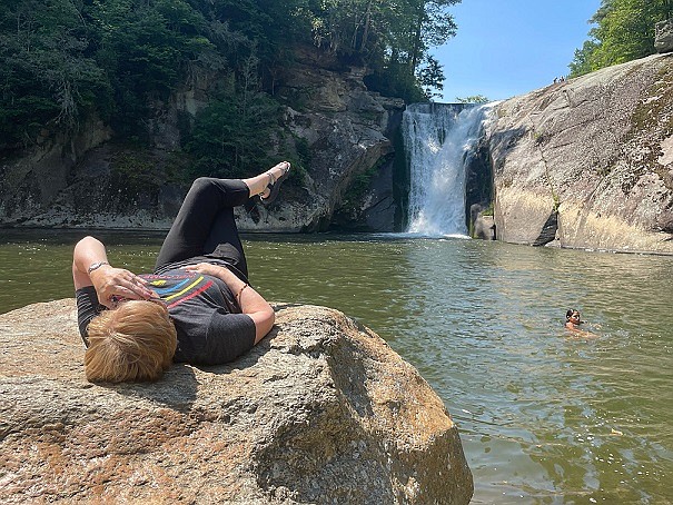 Margaret enjoying her “fave new retirement hobby, hiking for waterfalls”