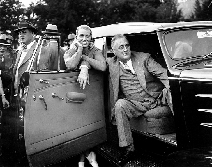 FDR and his daughter Anna watch a baseball game from the presidential motorcade in 1935. (AP/George Skadding)