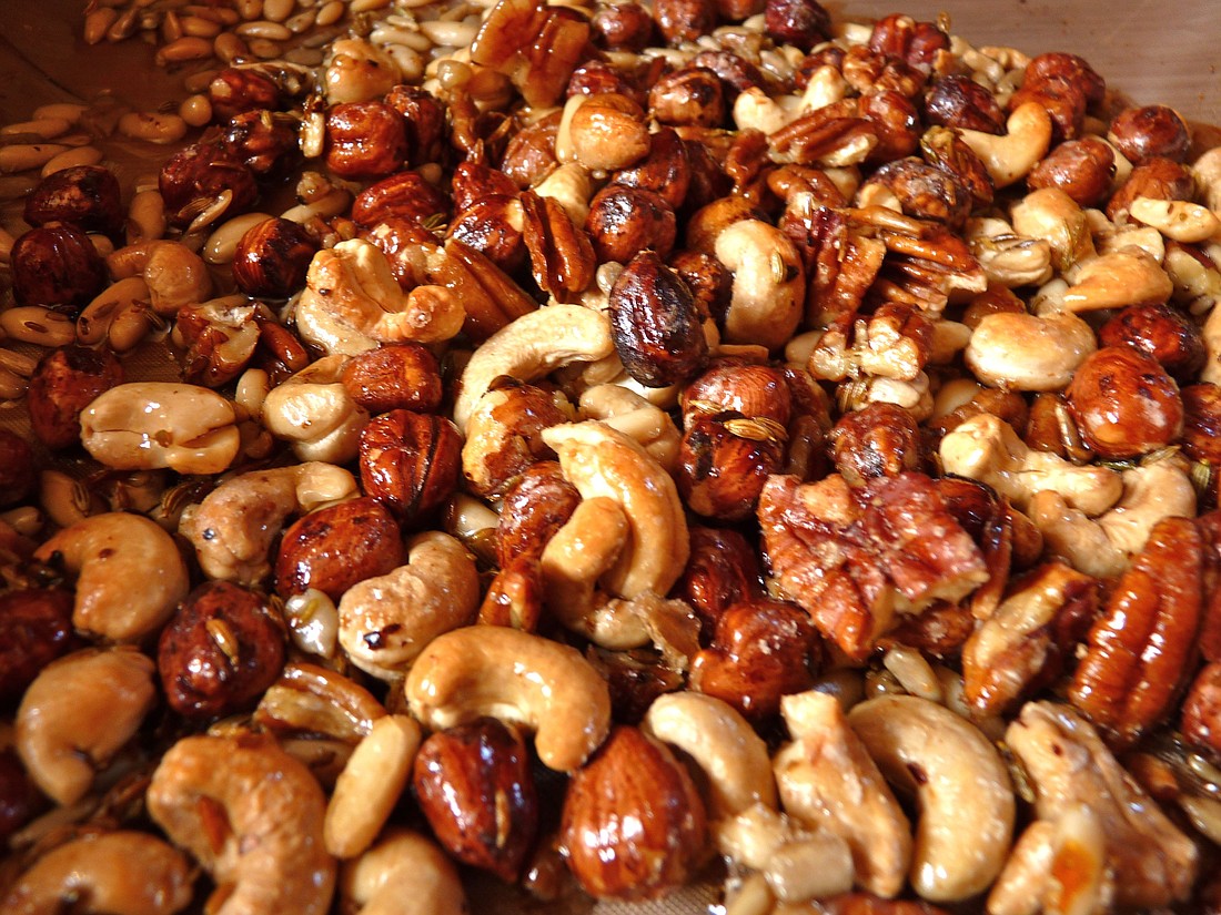You can make your own low-salt spiced nuts, which serve as a tasty vacation treat.