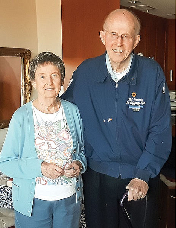 Bob Harmon, a Private First Class (PFC) fought in the Battle of Normandy, the Battle of the Bulge and served as one of the Monuments Men recovering artwork and treasures stolen by the Nazis. He is pictured with his wife, Virginia. Photo by Don Beyer.
