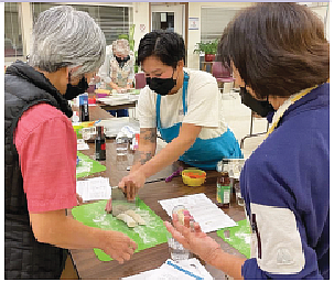 Gina Lee, former Cooking Matters Partnerships Coordinator, demonstrates how to cut dumplings, photo by Shana McCann, courtesy RSVPs Experience in Action newsletter