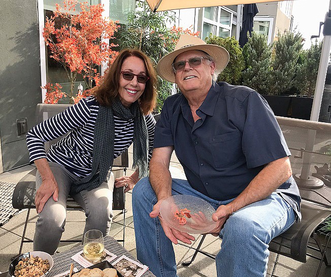 Sunny Lucia and her husband John Twitchell enjoying their deck at home in Seattle planning the next trip