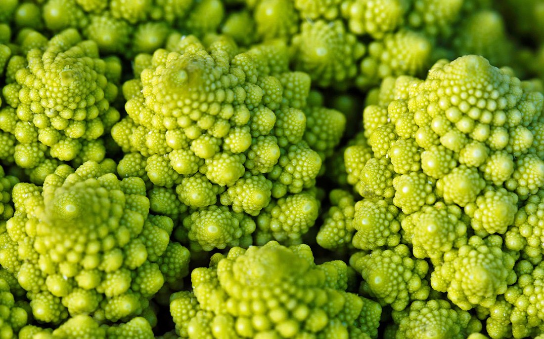 Romanesco, the odd shaped chartreuse vegetable, is a part of the cruciferous vegetable family and loaded with vitamins A, B, C, and K.