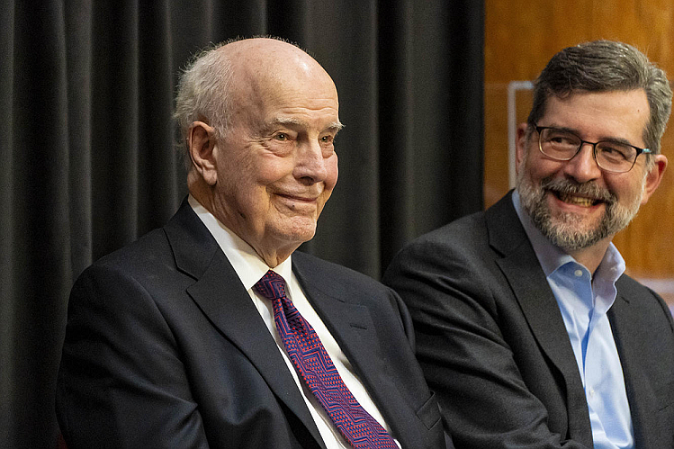 Former Governor Dan Evans, left, listens on stage next to John Carmichael, president of The Evergreen State College in Olympia, during an event on campus hosted by the Northwest Power and Conservation Council on April 9, 2024. Evans, 98, was Washington’s 16th governor, 1965-1977, and a U.S. senator 1983-1989. (David Ryder for Cascade PBS)
