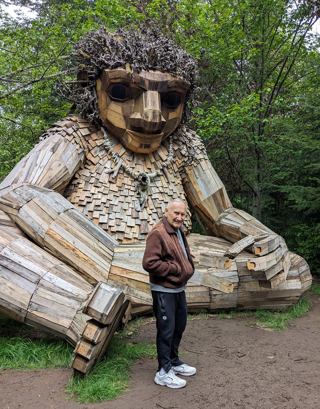 Roger with the Bainbridge Island troll, named Pia the Peacekeeper, an 18-foot-tall art installation awaiting discovery at Sakai Park