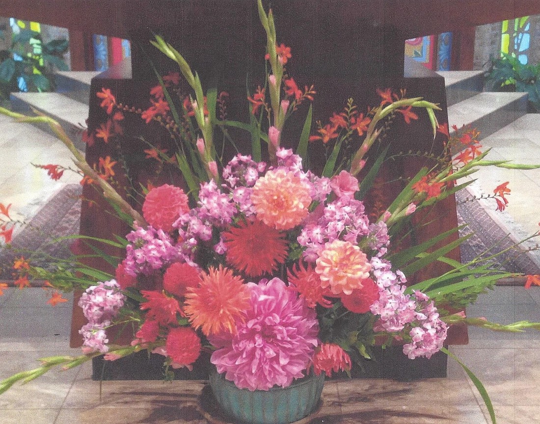 The photo on Loreta's Survival Tips book. Flower arranging is one of her passions.