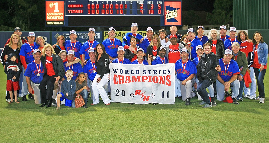 The Titans 55+ players, families and friends celebrate after their World Series AAAA Legends championship win over Nor-Cal Giants, 4-2. Photo courtesy of official Roy Hobbs photographer Greg Wagner www.wagnerphotograhy.com.  