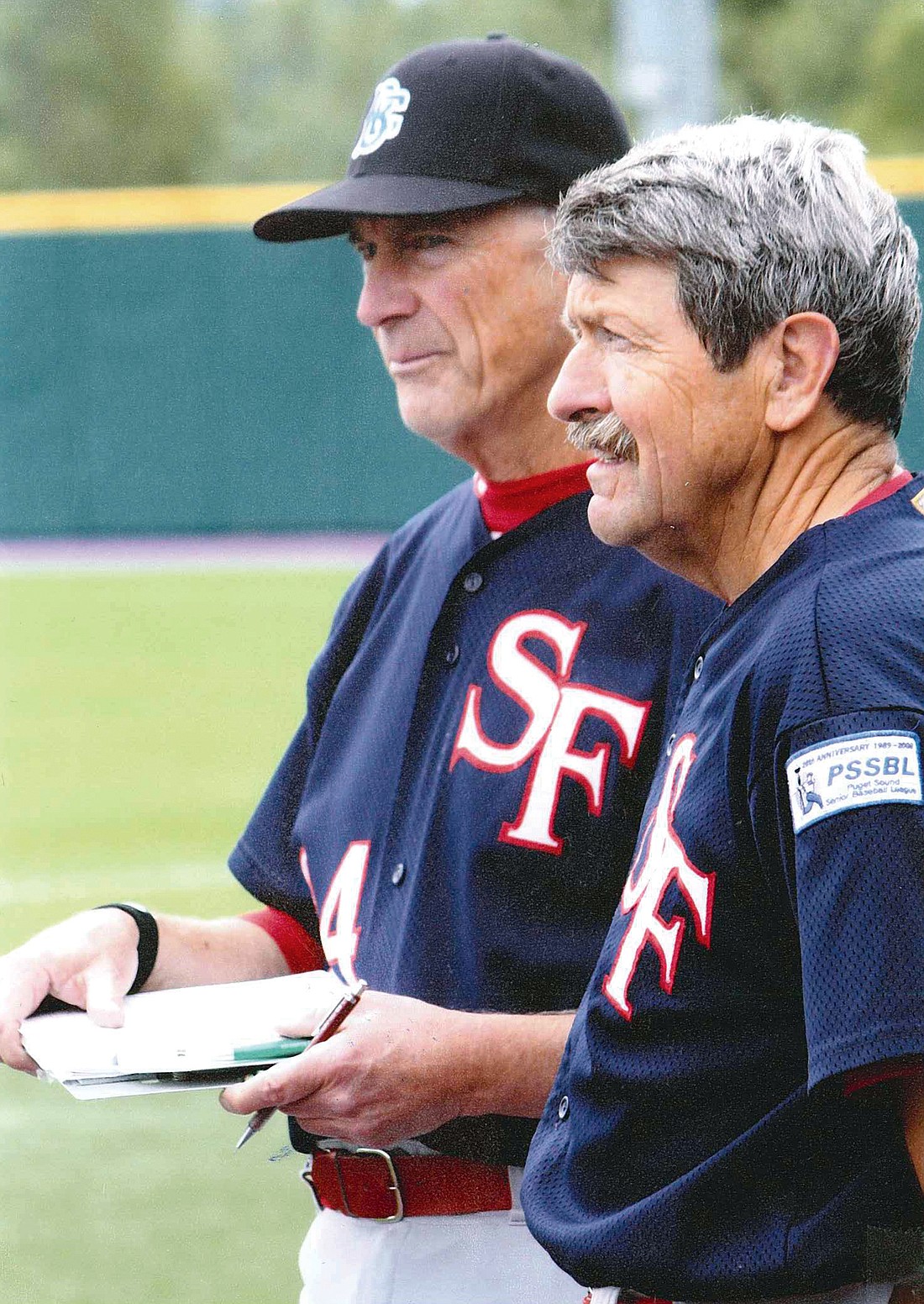 Dick Fitzgerald (l) and Ken Combs are a formidable pitcher/catcher duo in the Puget Sound Senior Baseball League. Photo courtesy of Ken & Susanne Combs