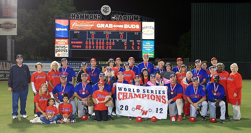 The 55+ Washington Titans celebrate their 2012 Roy Hobbs AAAA Legends division World Series Championship with family and friends in on Saturday, Nov. 10 in Ft. Myers, FL. Photo courtesy of Greg Wagner: www.wagnerphotography.com