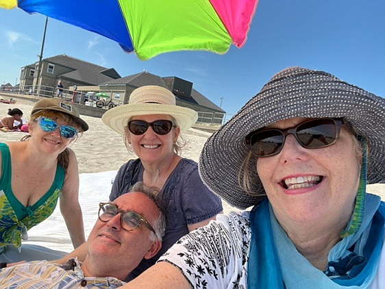 Rachel, Mona, Bob, and Becky on a visit to Scarborough Beach in Rhode Island. Enjoying the sun and the sound of ocean waves. Picture taken on August 20,2022